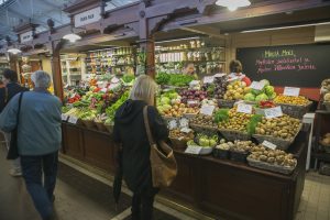 helsinki, finland - June 30, 2014: people are shopping vegetable at historical covered market at port of helsinki finland